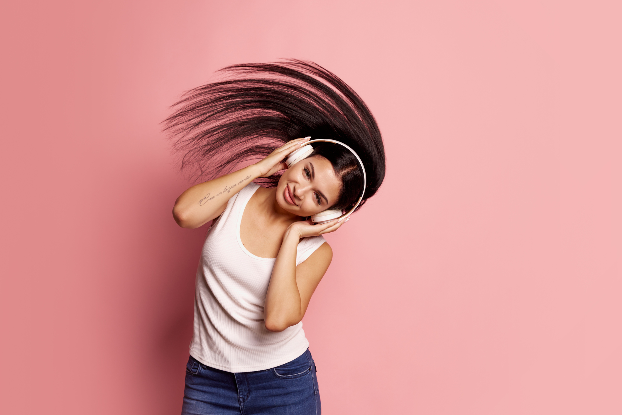 Portrait of adorable young girl, student wearing casual style clothes isolated on pink color background. Concept of beauty, art, fashion, emotions